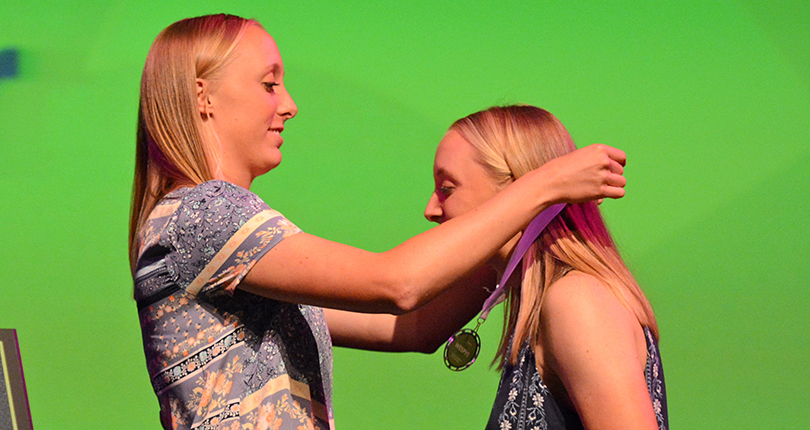 Sawyer Hooper places Female Athlete of the Year medal around the neck of twin sister, Savannah Hooper during the Fifth Annual WESPYs Awards Tuesday. (Wilmington photo/Randy Sarvis)