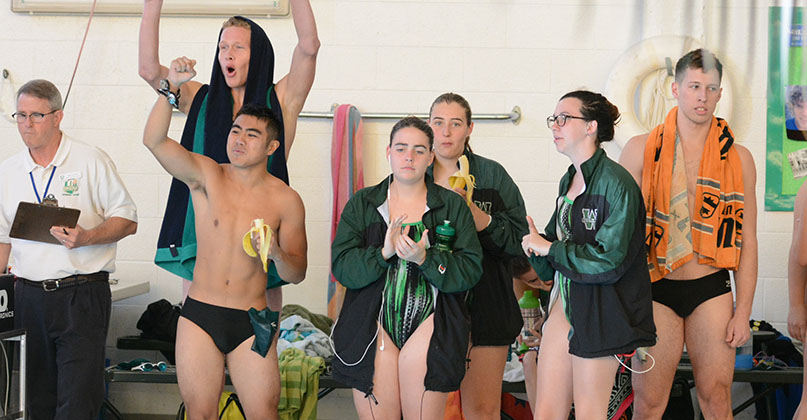 @DubC_Swimming men excel at double-dual meet